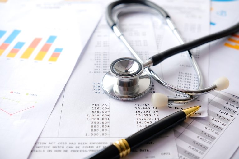 Stethoscope with Pen, Charts and Graphs, Finance, Account, Statistics, Investment, Analytic Research Data Economy Spreadsheet and Business Company Concept